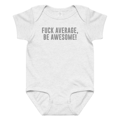 "Fuck Average, Be Awesome!" printed on a ash baby jersey bodysuit laying on a flat surface amongst other clothes