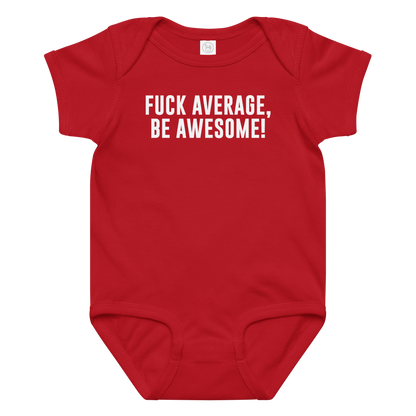 "Fuck Average, Be Awesome!" printed on a red baby jersey bodysuit laying on a flat surface amongst other clothes