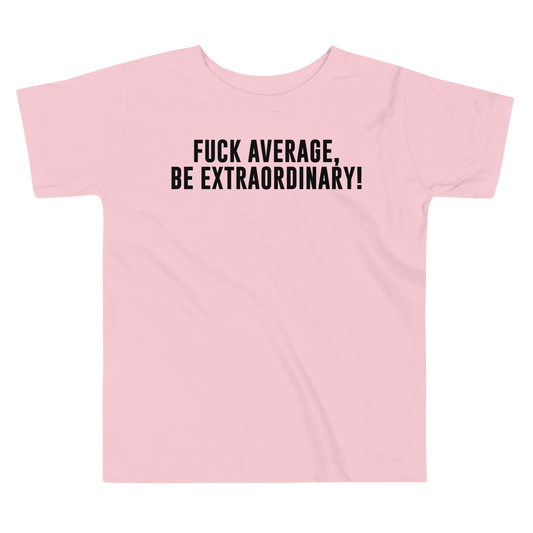 "Fuck Average, Be Extraordinary!" printed on a pink toddler short sleeve tee laying on a flat surface