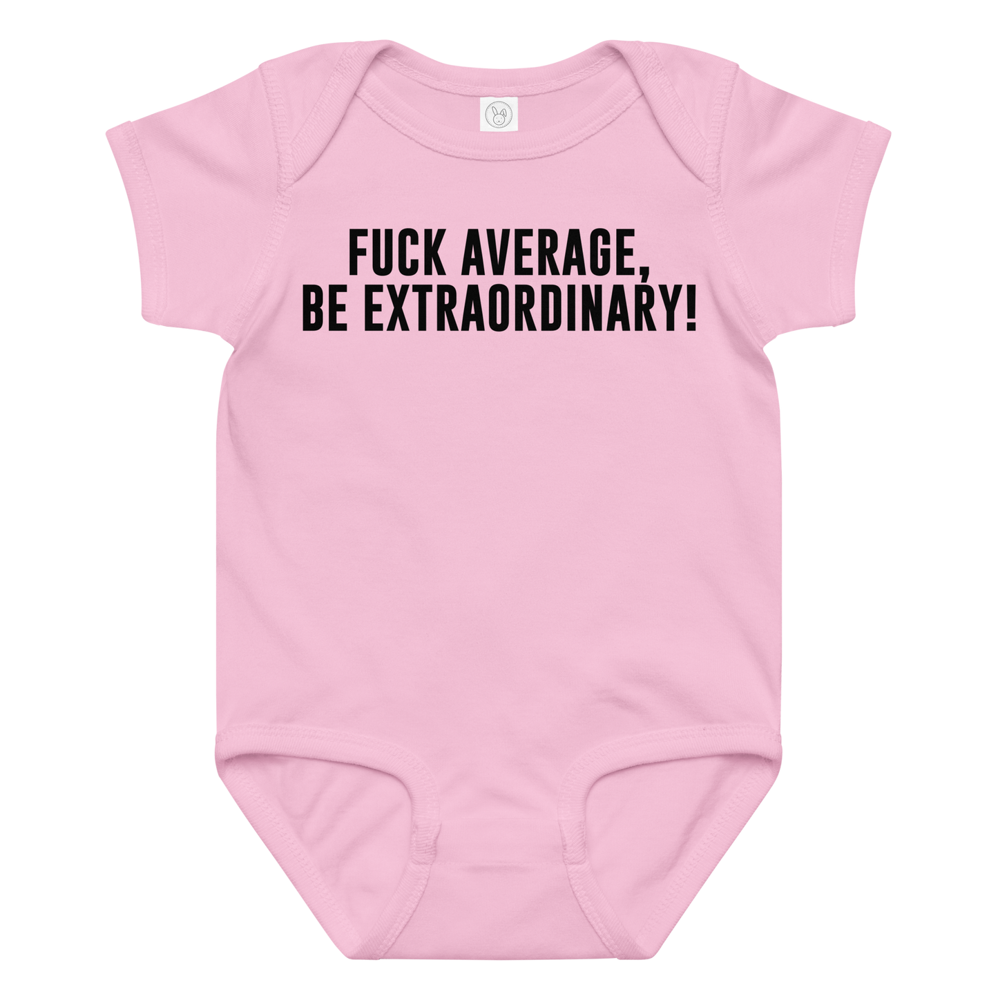 "Fuck Average, Be Extraordinary!" printed on a pink baby jersey bodysuit laying on a flat surface amongst other clothes