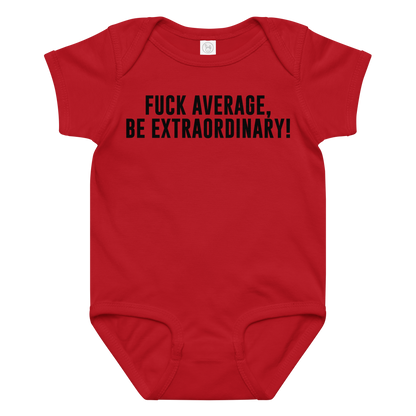 "Fuck Average, Be Extraordinary!" printed on a red baby jersey bodysuit laying on a flat surface amongst other clothes