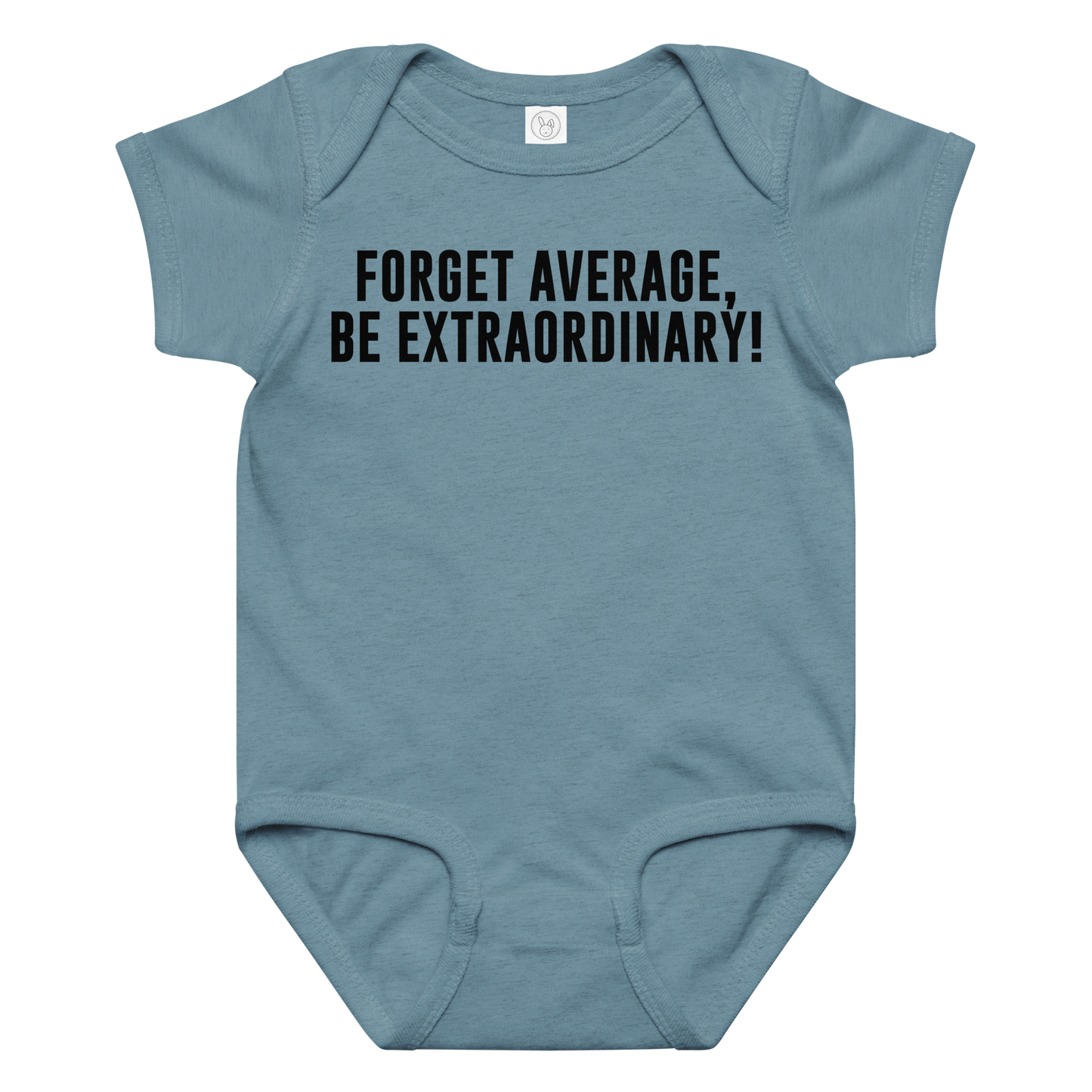 "Forget Average, Be Extraordinary!" printed on a vintage indigo baby jersey bodysuit laying on a flat surface amongst other clothes