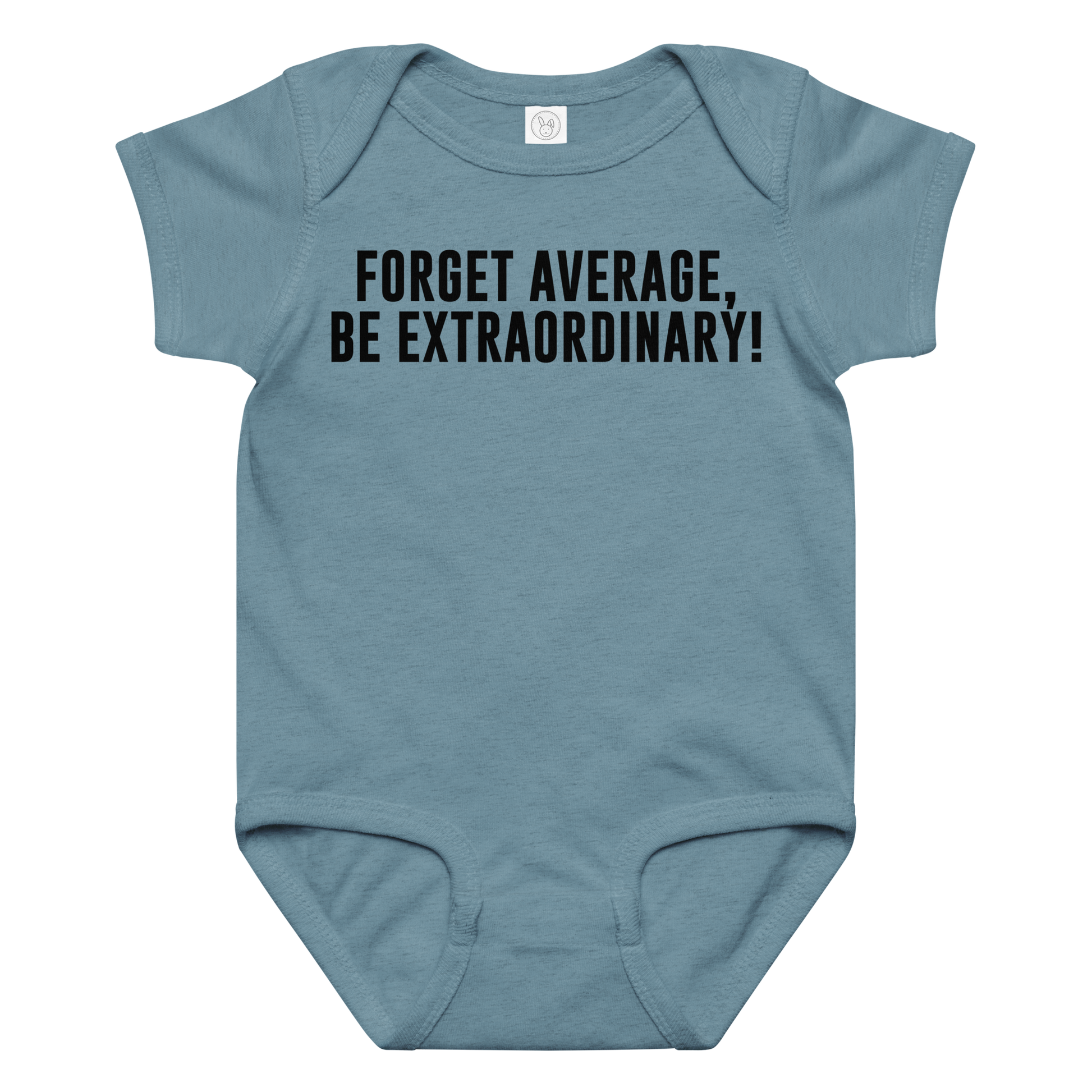 "Forget Average, Be Extraordinary!" printed on a vintage indigo baby jersey bodysuit laying on a flat surface amongst other clothes