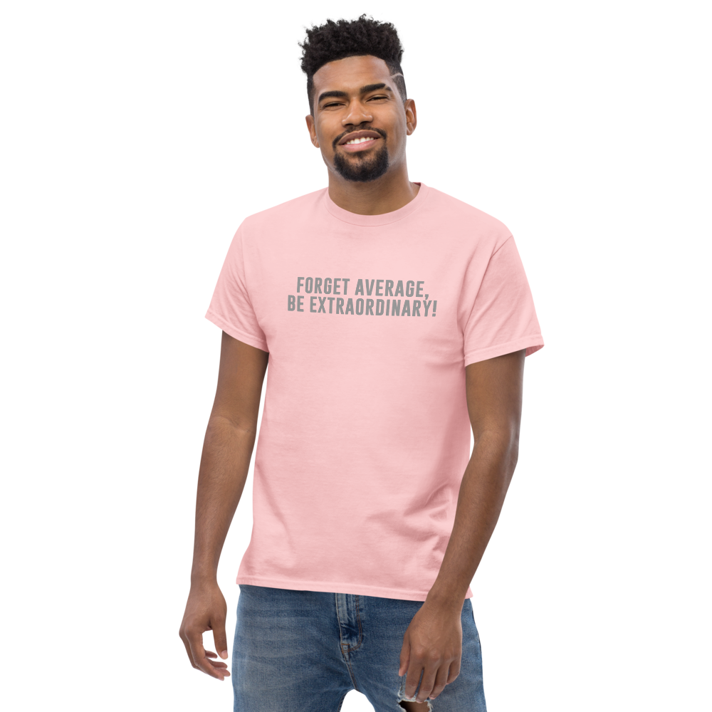 "Forget Average, Be Extraordinary!" printed on a light pink unisex classic tee worn by a male