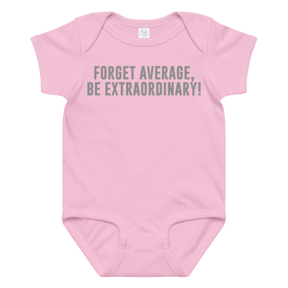 "Forget Average, Be Extraordinary!" printed on a pink baby jersey bodysuit laying on a flat surface amongst other clothes
