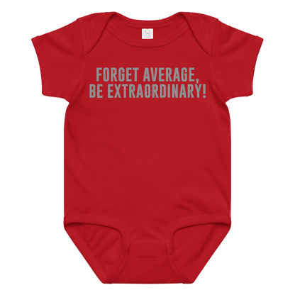 "Forget Average, Be Extraordinary!" printed on a red baby jersey bodysuit laying on a flat surface amongst other clothes