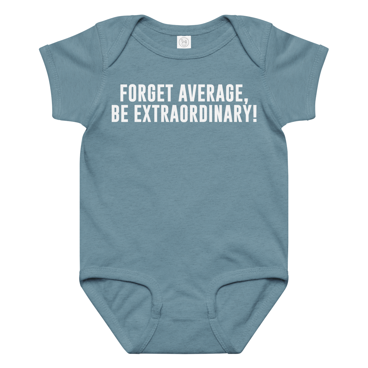 "Forget Average, Be Extraordinary!" printed on a vintage indigo baby jersey bodysuit laying on a flat surface amongst other clothes