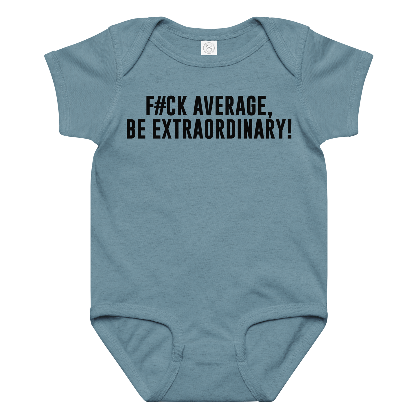 "F#Ck Average, Be Extraordinary!" printed on a vintage indigo baby jersey bodysuit laying on a flat surface amongst other clothes