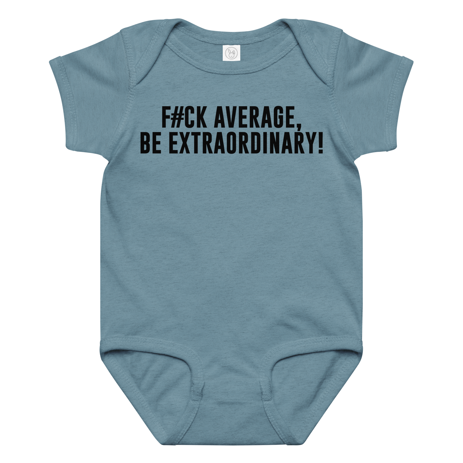 "F#Ck Average, Be Extraordinary!" printed on a vintage indigo baby jersey bodysuit laying on a flat surface amongst other clothes