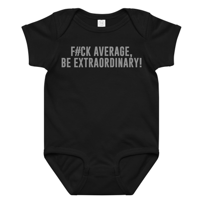 "F#Ck Average, Be Extraordinary!" printed on a black baby jersey bodysuit laying on a flat surface amongst other clothes