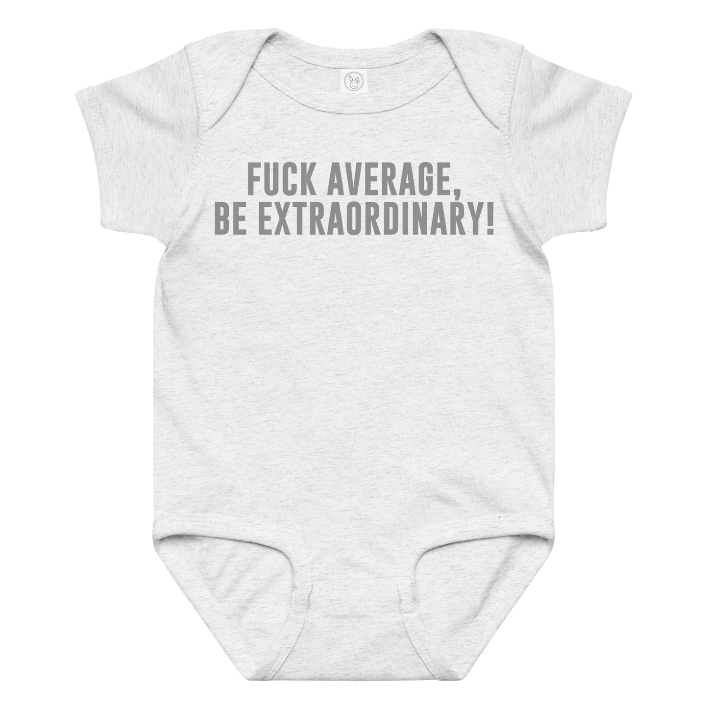 "Fuck Average, Be Extraordinary!" printed on a ash baby jersey bodysuit laying on a flat surface amongst other clothes