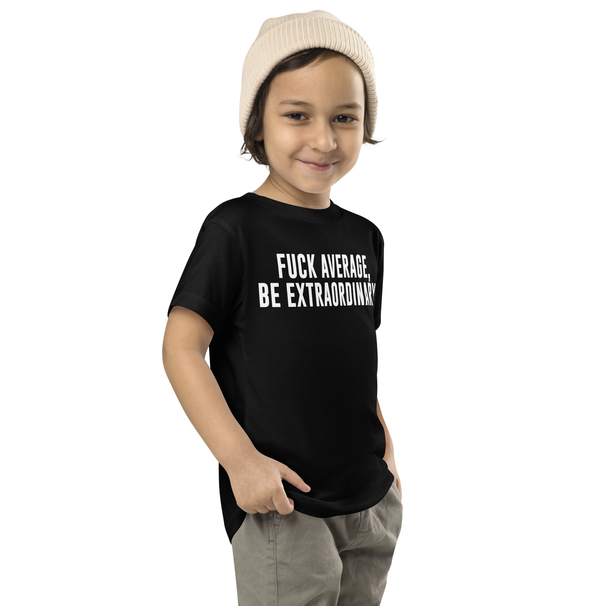 "Fuck Average, Be Extraordinary!" printed on a black toddler short sleeve tee worn by a male who is also wearing a knit cap