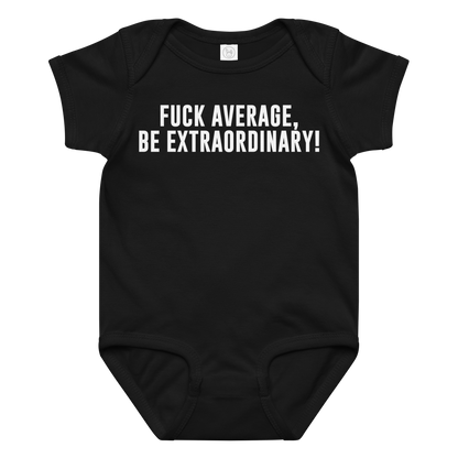 "Fuck Average, Be Extraordinary!" printed on a black baby jersey bodysuit laying on a flat surface amongst other clothes
