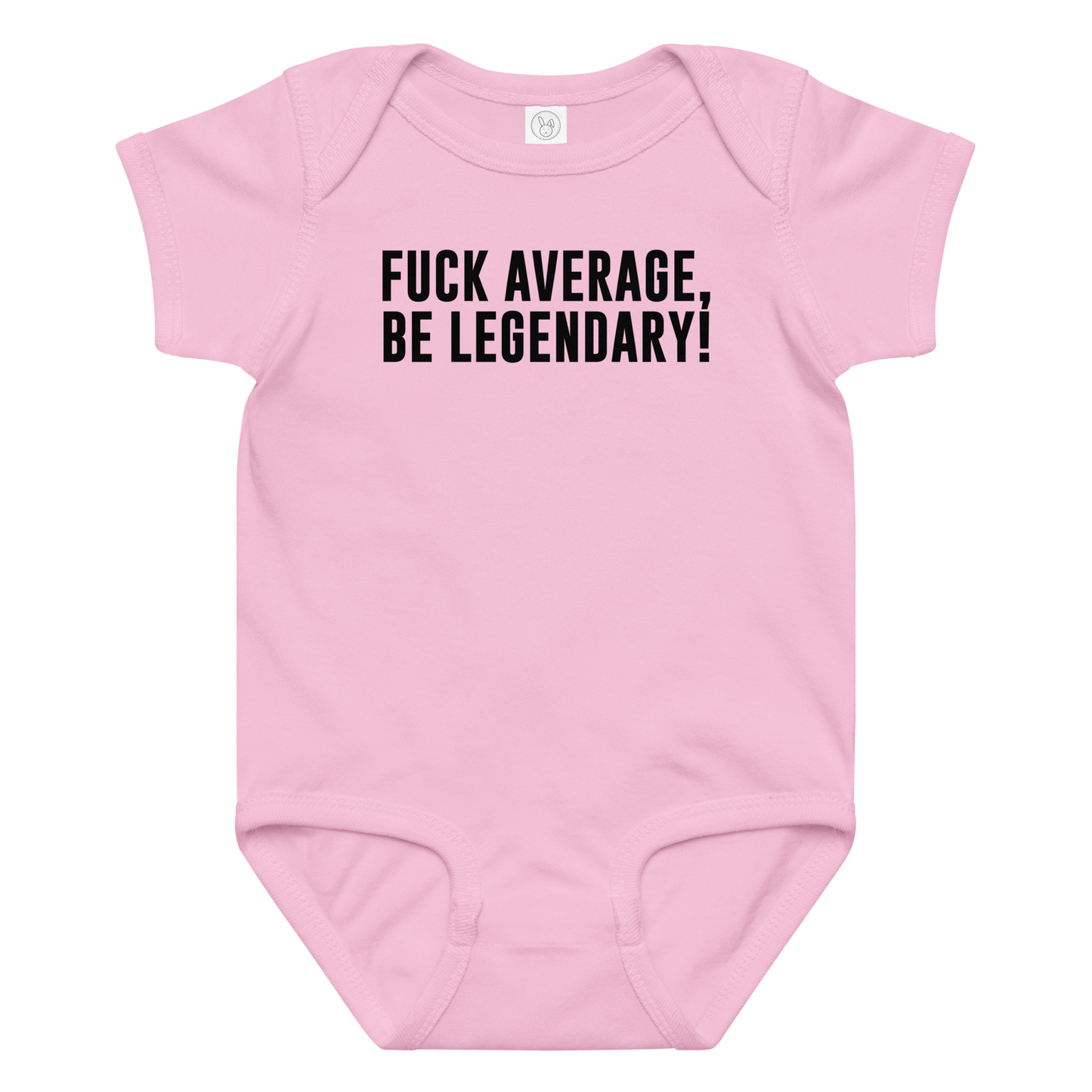 "Fuck Average, Be Legendary!" printed on a pink baby jersey bodysuit laying on a flat surface amongst other clothes