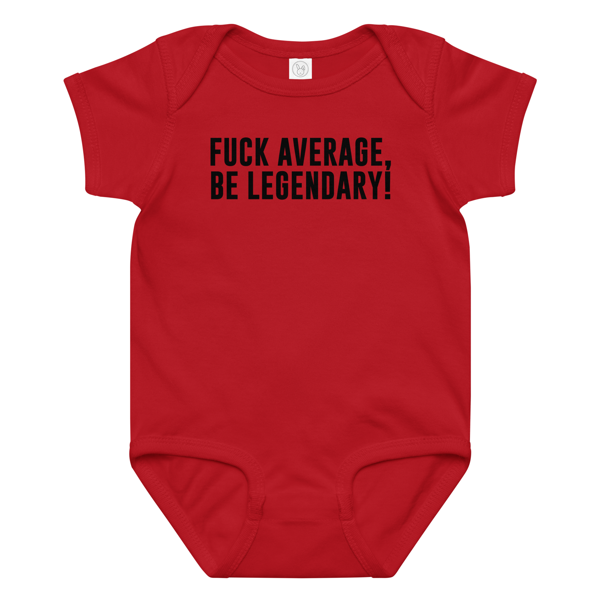 "Fuck Average, Be Legendary!" printed on a red baby jersey bodysuit laying on a flat surface amongst other clothes