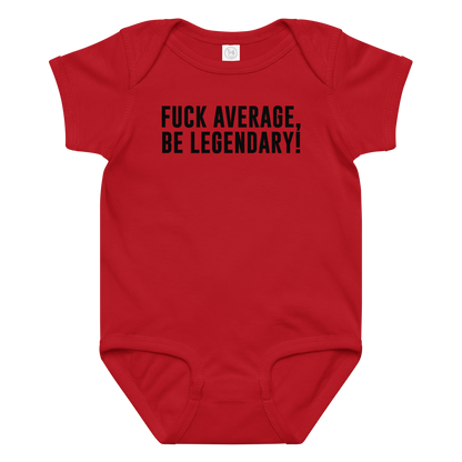 "Fuck Average, Be Legendary!" printed on a red baby jersey bodysuit laying on a flat surface amongst other clothes
