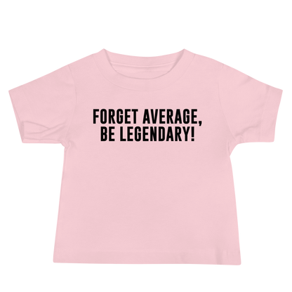 "Forget Average, Be Legendary!" printed on a pink baby jersey short sleeve tee laying on a flat surface