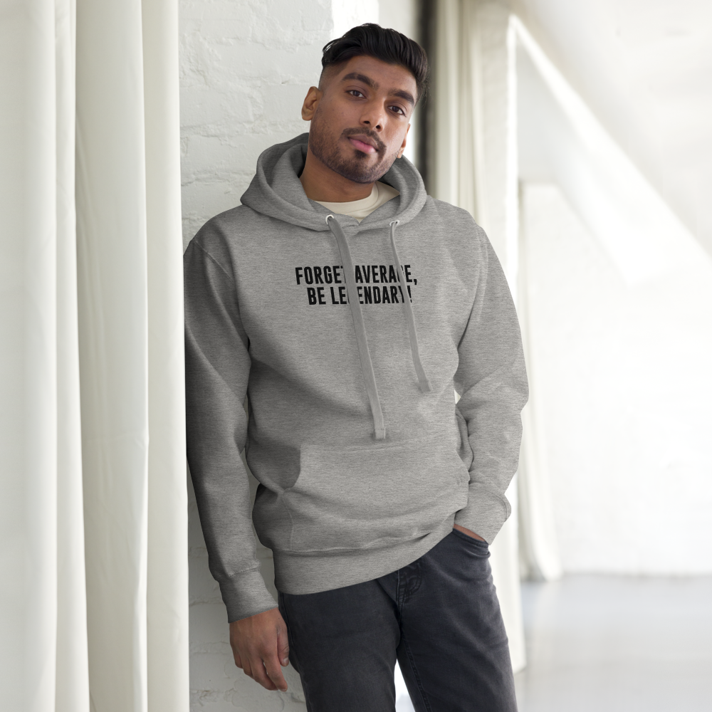 "Forget Average, Be Legendary!" printed on a carbon grey unisex hoodie worn by a male