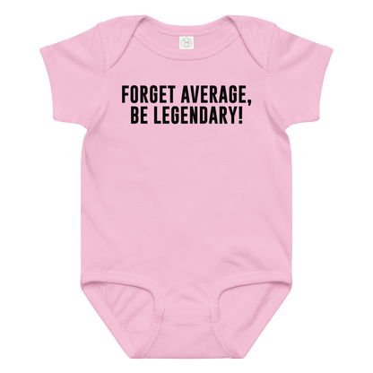 "Forget Average, Be Legendary!" printed on a pink baby jersey bodysuit laying on a flat surface amongst other clothes