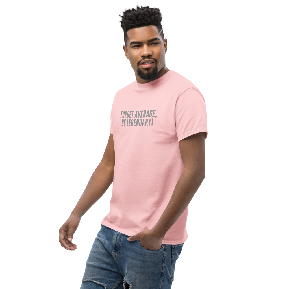 "Forget Average, Be Legendary!" printed on a light pink unisex classic tee worn by a male