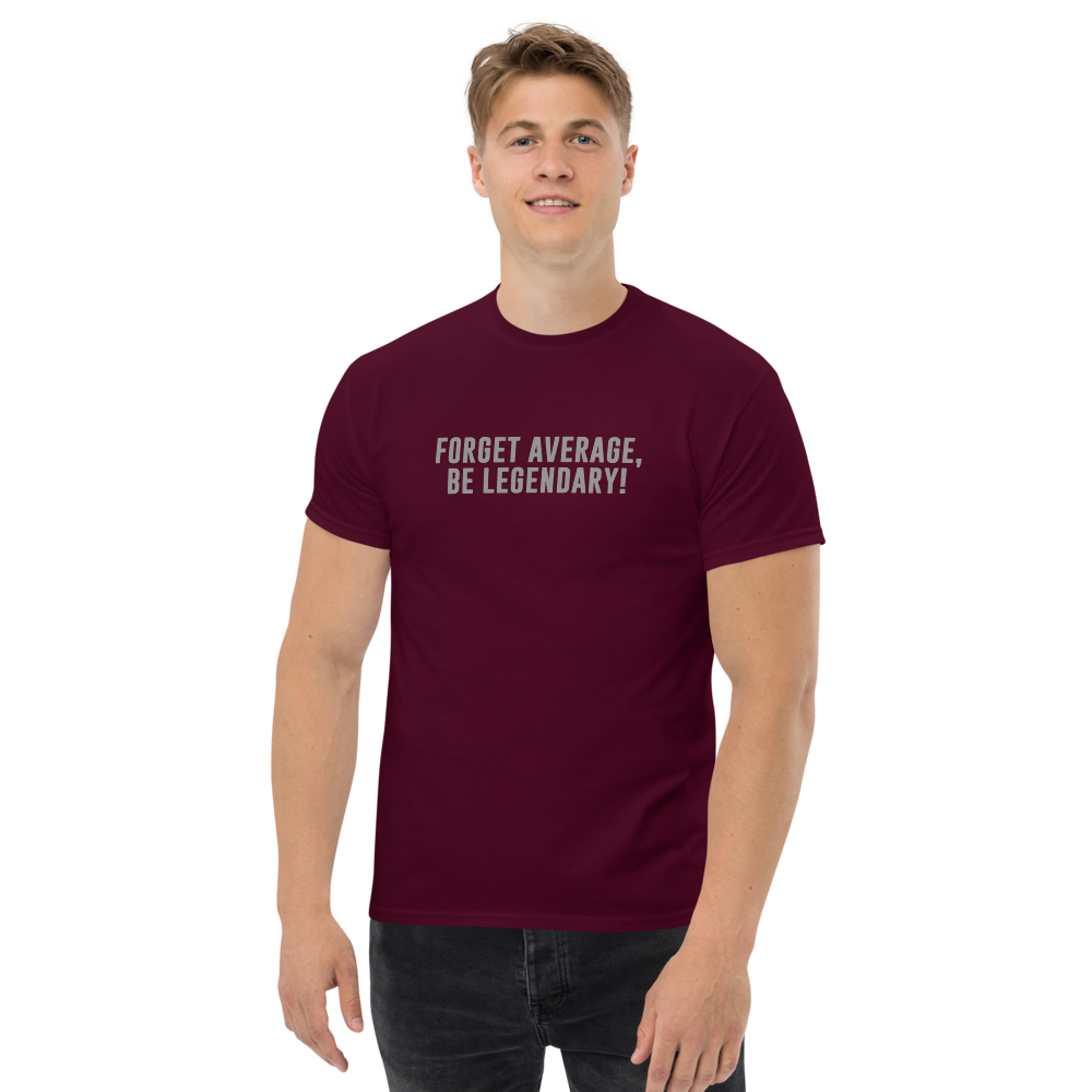 "Forget Average, Be Legendary!" printed on a maroon unisex classic tee worn by a male