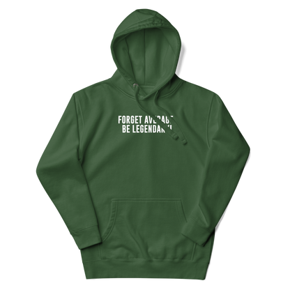 "Forget Average, Be Legendary!" printed on a forest green unisex hoodie laying on a flat surface with the hood up