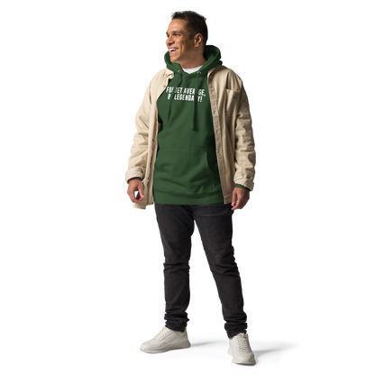"Forget Average, Be Legendary!" printed on a forest green unisex hoodie worn by a male with a jacket on top