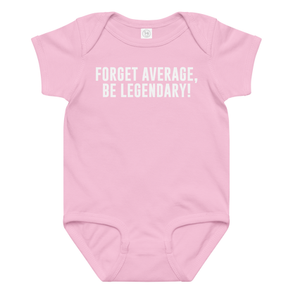 "Forget Average, Be Legendary!" printed on a pink baby jersey bodysuit laying on a flat surface amongst other clothes