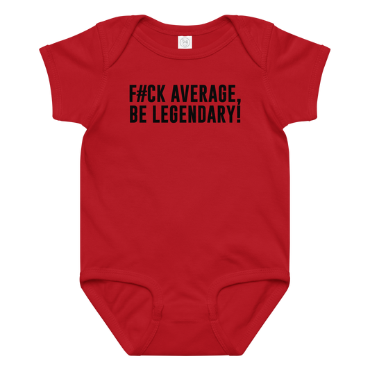 "F#Ck Average, Be Legendary!" printed on a red baby jersey bodysuit laying on a flat surface amongst other clothes