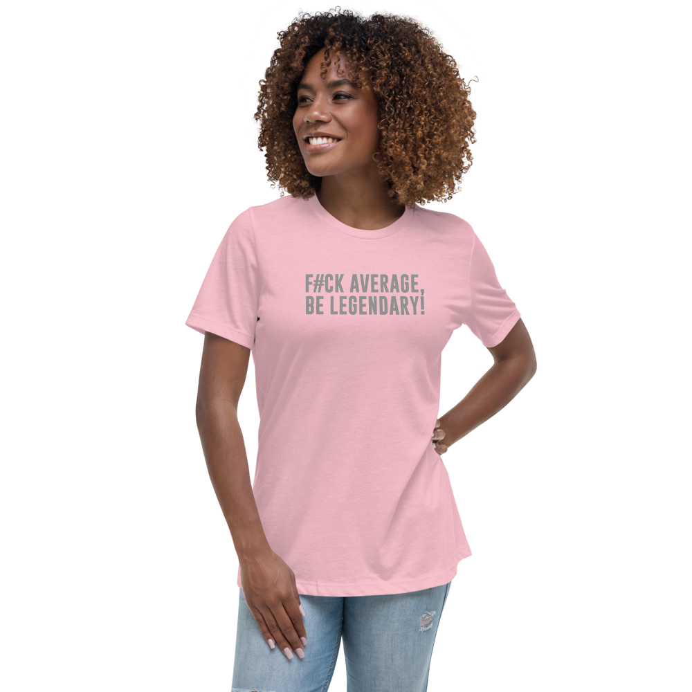"F#Ck Average, Be Legendary!" printed on a pink women's relaxed t-shirt worn by a female
