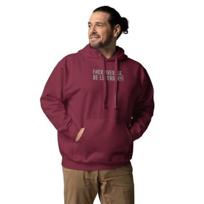 "F#Ck Average, Be Legendary!" printed on a maroon unisex hoodie worn by a male