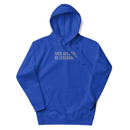 "F#Ck Average, Be Legendary!" printed on a team royal unisex hoodie laying on a flat surface with the hood up
