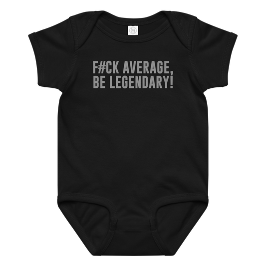 "F#Ck Average, Be Legendary!" printed on a black baby jersey bodysuit laying on a flat surface amongst other clothes