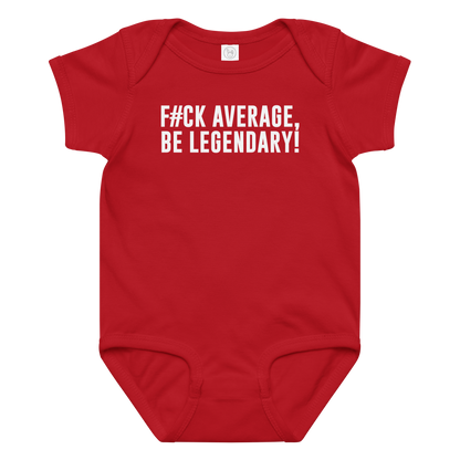 "F#Ck Average, Be Legendary!" printed on a red baby jersey bodysuit laying on a flat surface amongst other clothes