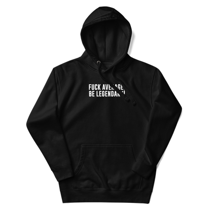 "Fuck Average, Be Legendary!" printed on a black unisex hoodie laying on a flat surface with the hood up