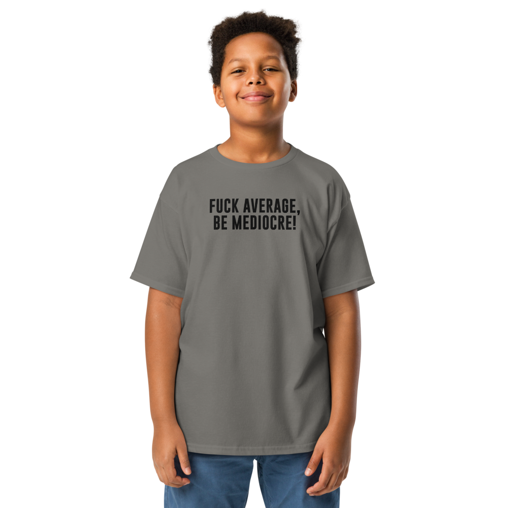 "Fuck Average, Be Mediocre!" printed on a charcoal youth classic tee worn by a male