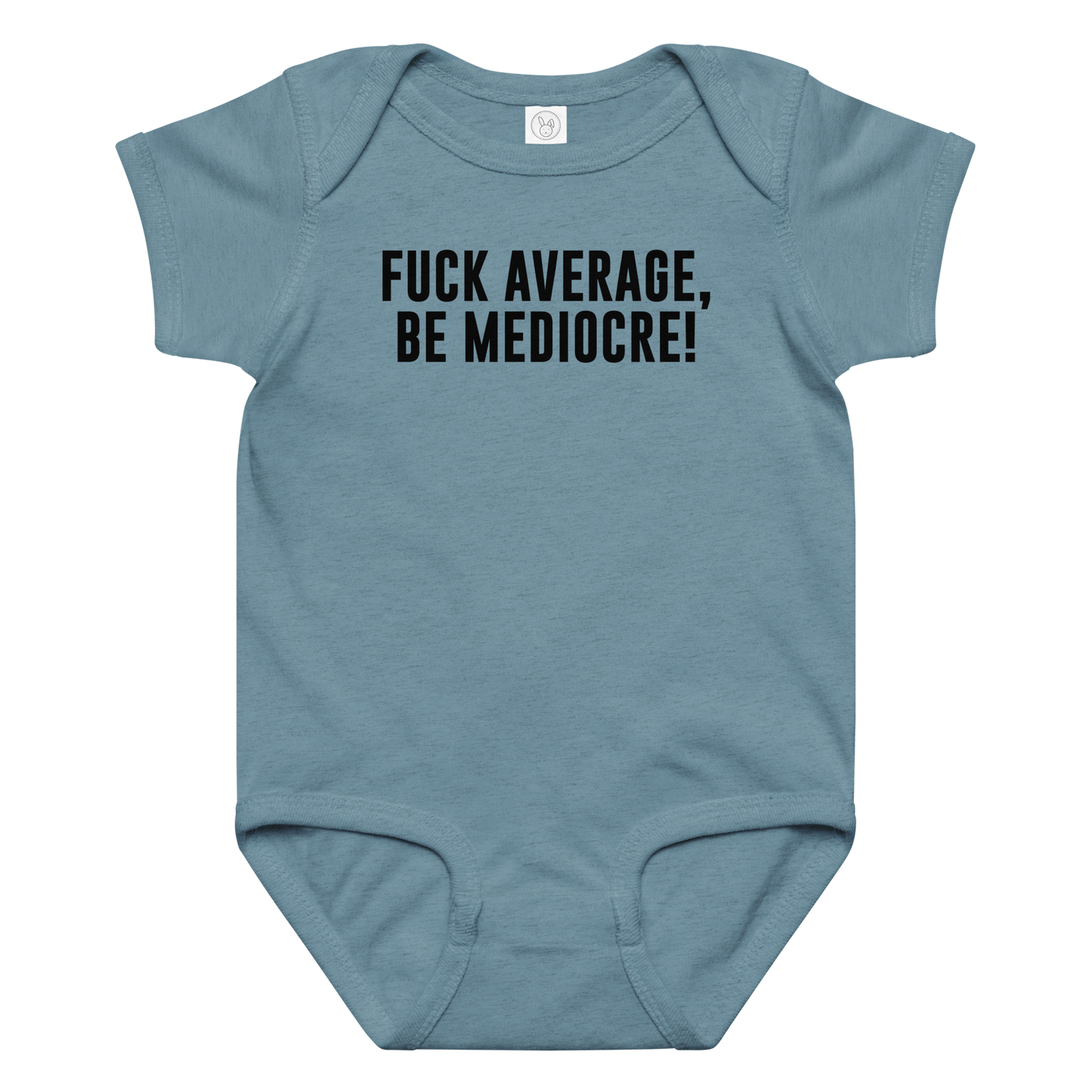 "Fuck Average, Be Mediocre!" printed on a vintage indigo baby jersey bodysuit laying on a flat surface amongst other clothes