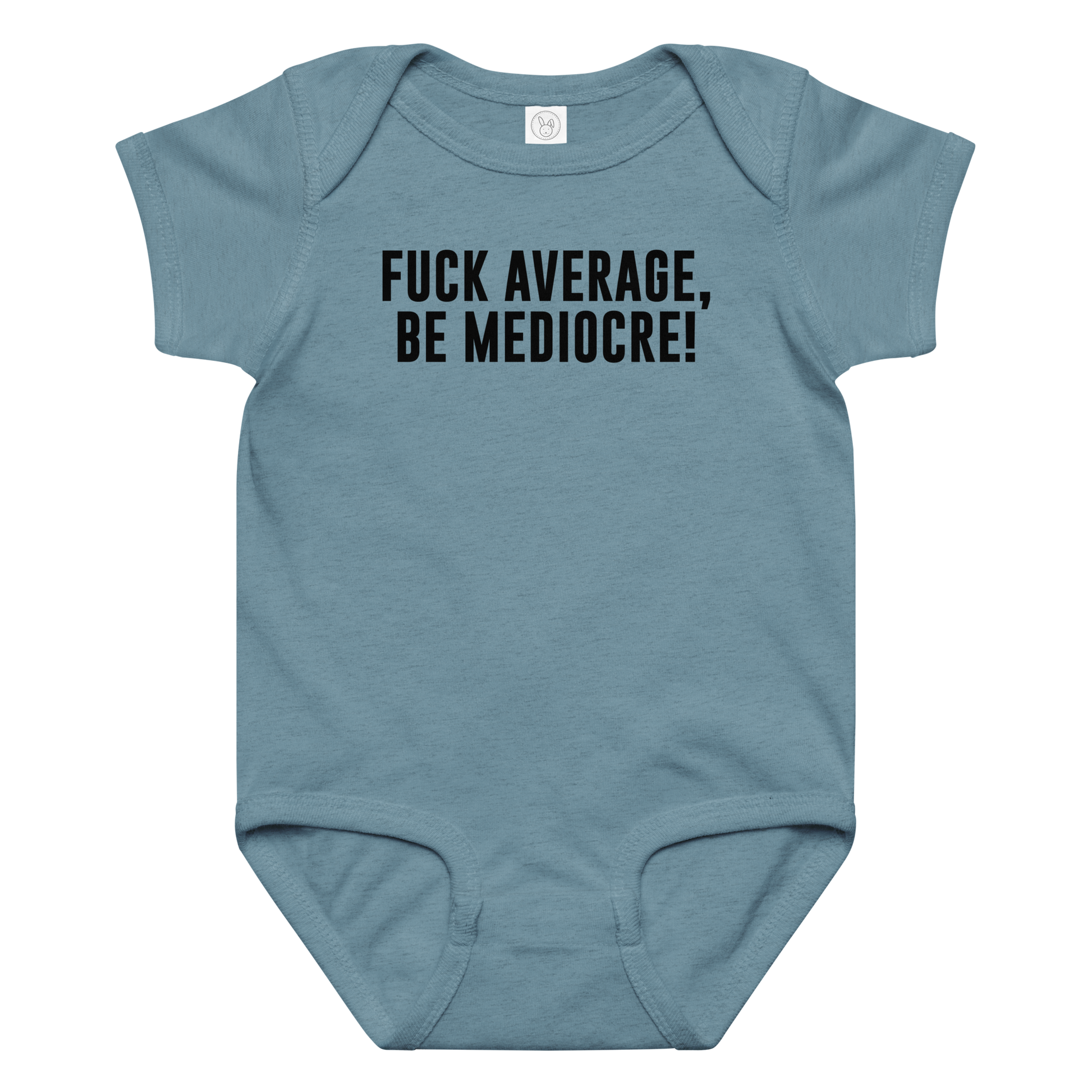 "Fuck Average, Be Mediocre!" printed on a vintage indigo baby jersey bodysuit laying on a flat surface amongst other clothes