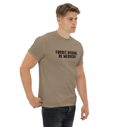 "Forget Average, Be Mediocre!" printed on a brown savana unisex classic tee worn by a male