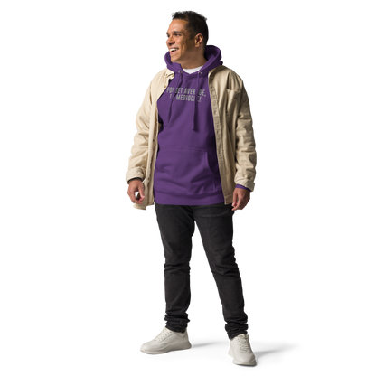 "Forget Average, Be Mediocre!" printed on a purple unisex hoodie worn by a male with a jacket on top