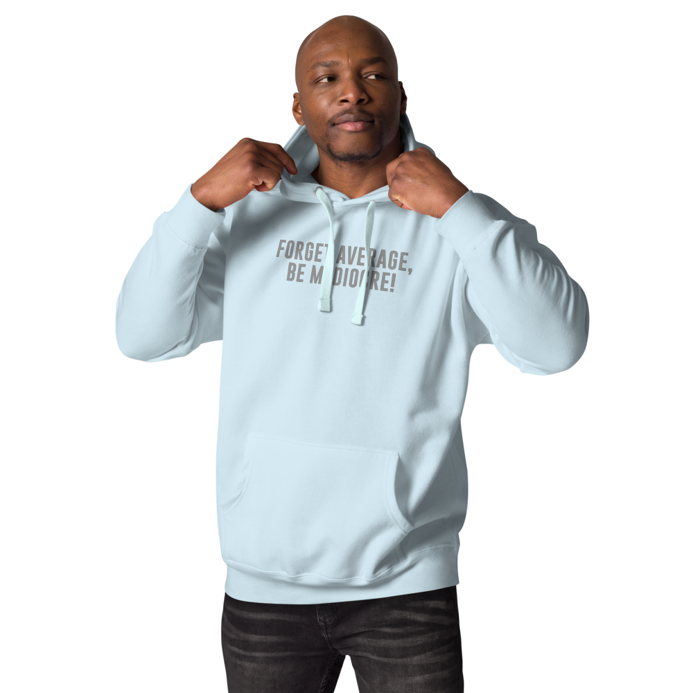 "Forget Average, Be Mediocre!" printed on a sky blue unisex hoodie worn by a male