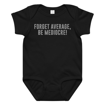"Forget Average, Be Mediocre!" printed on a black baby jersey bodysuit laying on a flat surface amongst other clothes