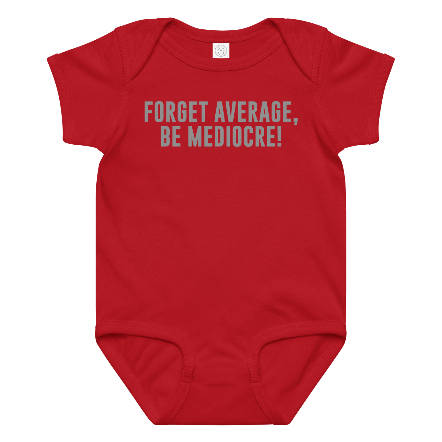 "Forget Average, Be Mediocre!" printed on a red baby jersey bodysuit laying on a flat surface amongst other clothes