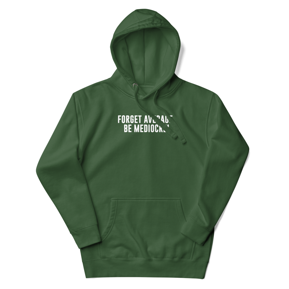"Forget Average, Be Mediocre!" printed on a forest green unisex hoodie laying on a flat surface with the hood up