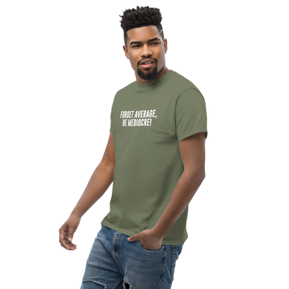 "Forget Average, Be Mediocre!" printed on a military green unisex classic tee worn by a male