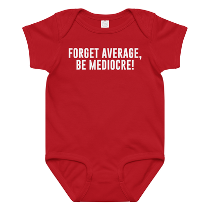 "Forget Average, Be Mediocre!" printed on a red baby jersey bodysuit laying on a flat surface amongst other clothes