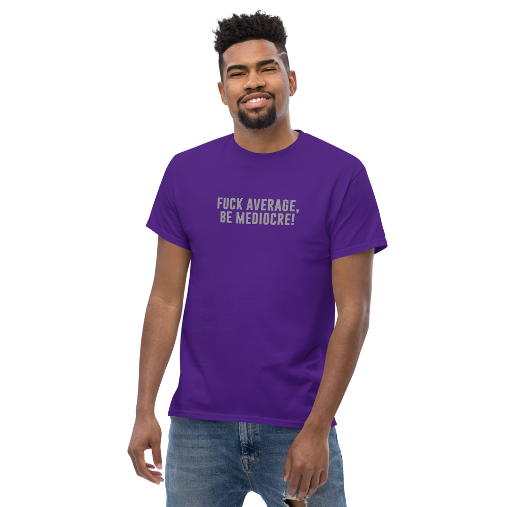 "Fuck Average, Be Mediocre!" printed on a purple unisex classic tee worn by a male