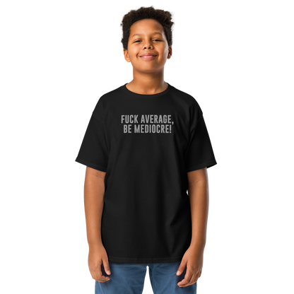 "Fuck Average, Be Mediocre!" printed on a black youth classic tee worn by a male