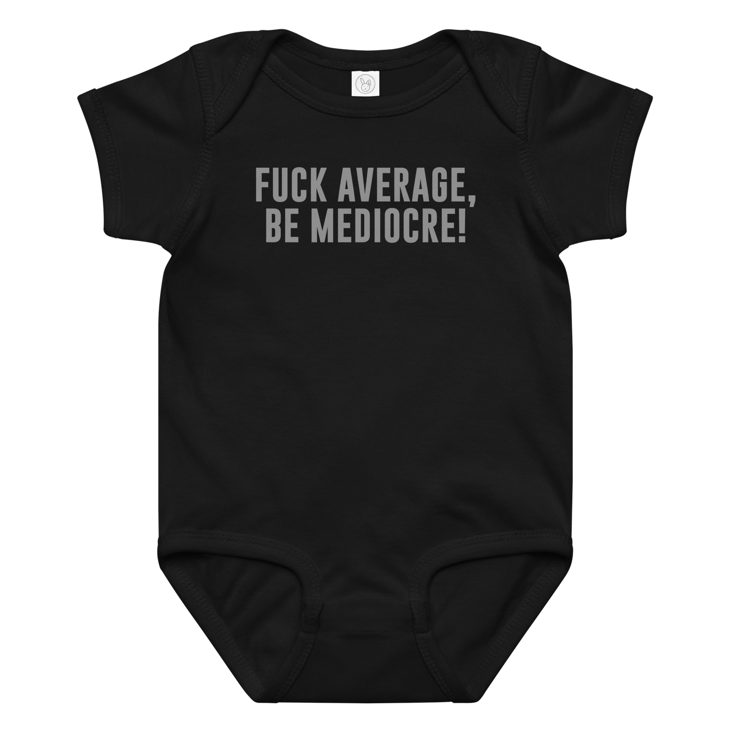 "Fuck Average, Be Mediocre!" printed on a black baby jersey bodysuit laying on a flat surface amongst other clothes