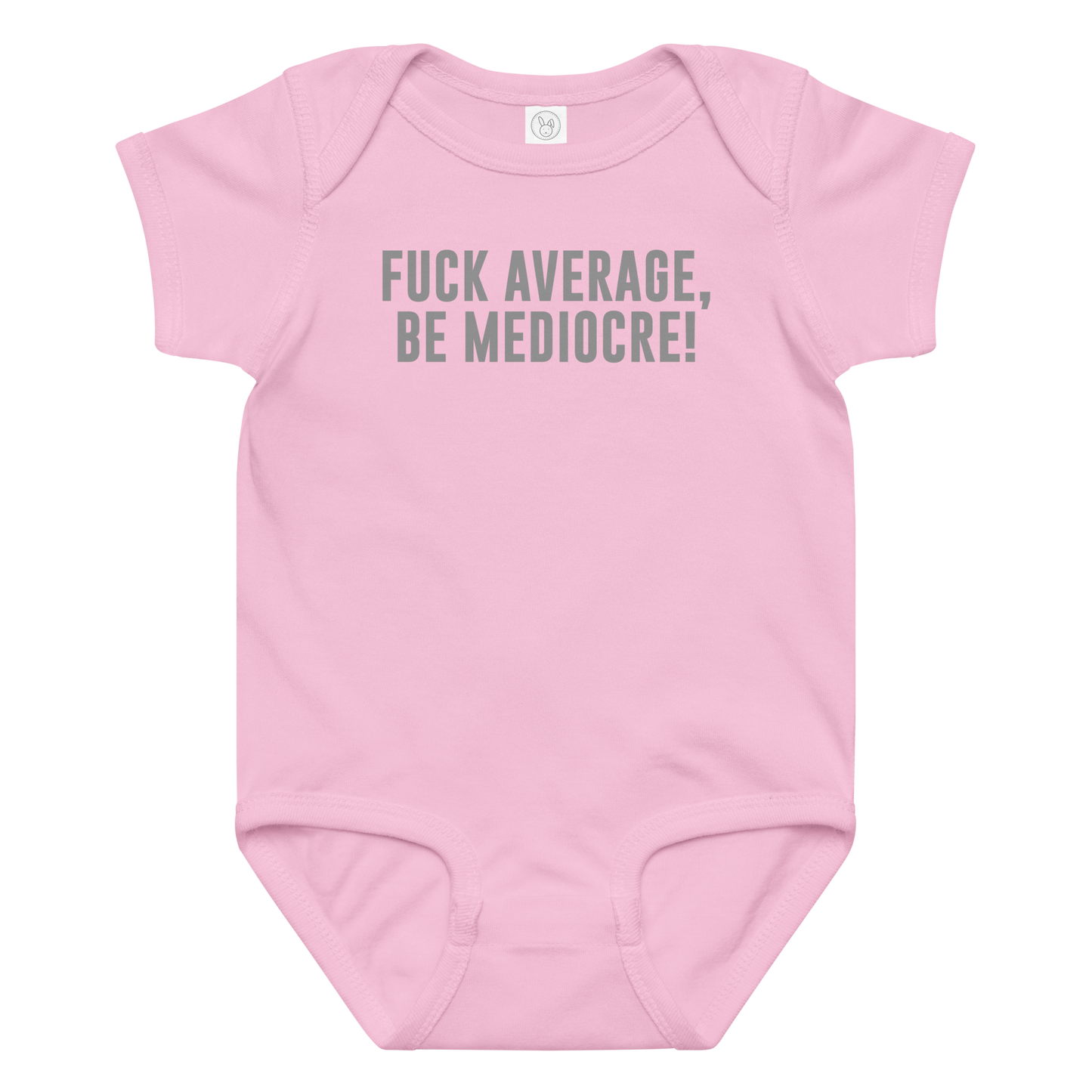 "Fuck Average, Be Mediocre!" printed on a pink baby jersey bodysuit laying on a flat surface amongst other clothes